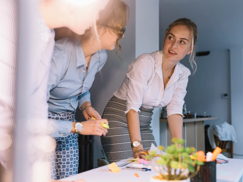 female colleague discussing business plan workplace